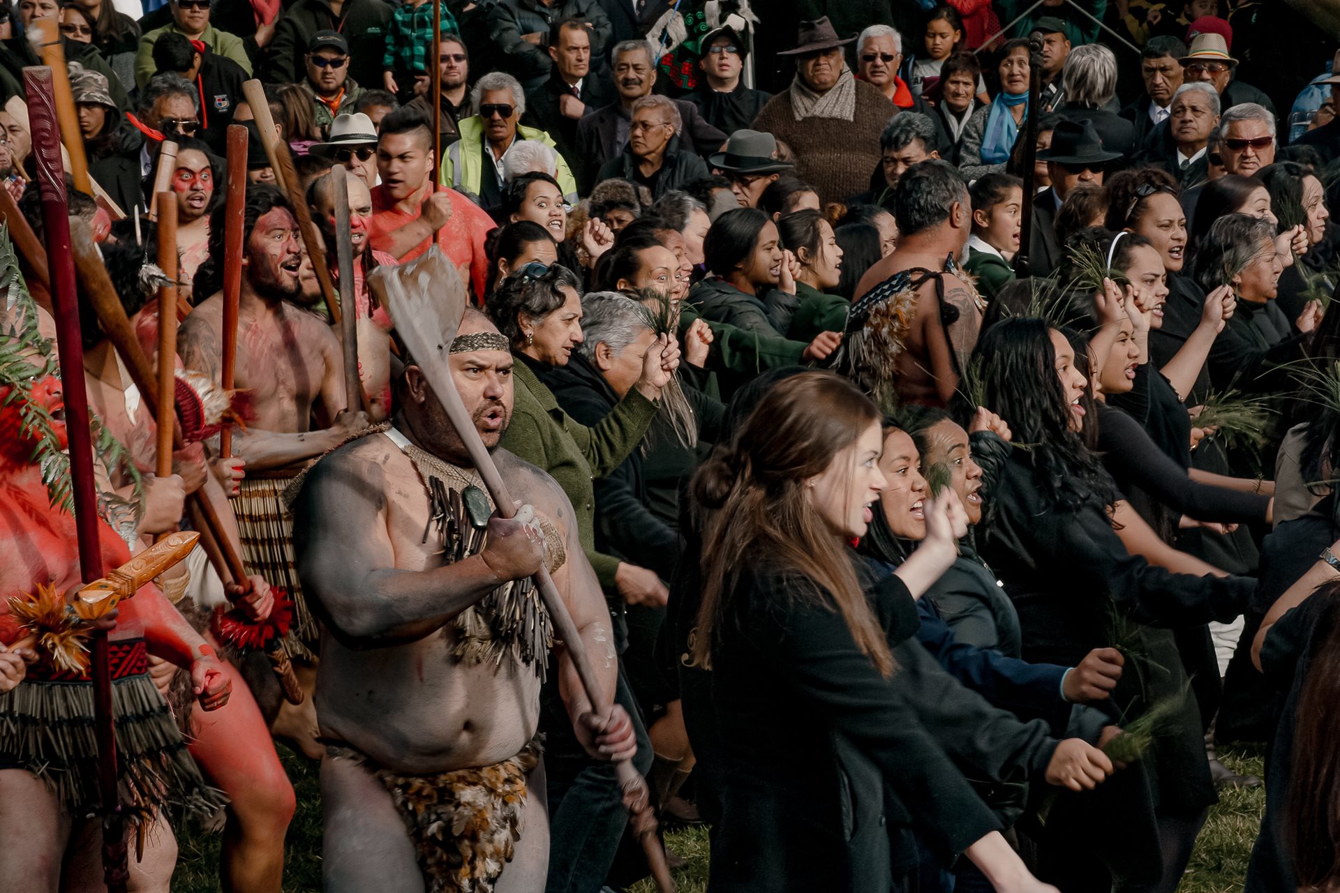 Tūhoe people perform a haka, a traditional dance and welcome (also sometimes a chant of challenge) in Tāneatua, New Zealand, as government officials arrive for the 2014 Tūhoe-Crown Settlement Day ceremony, where the government formally apologized for historical injustices.