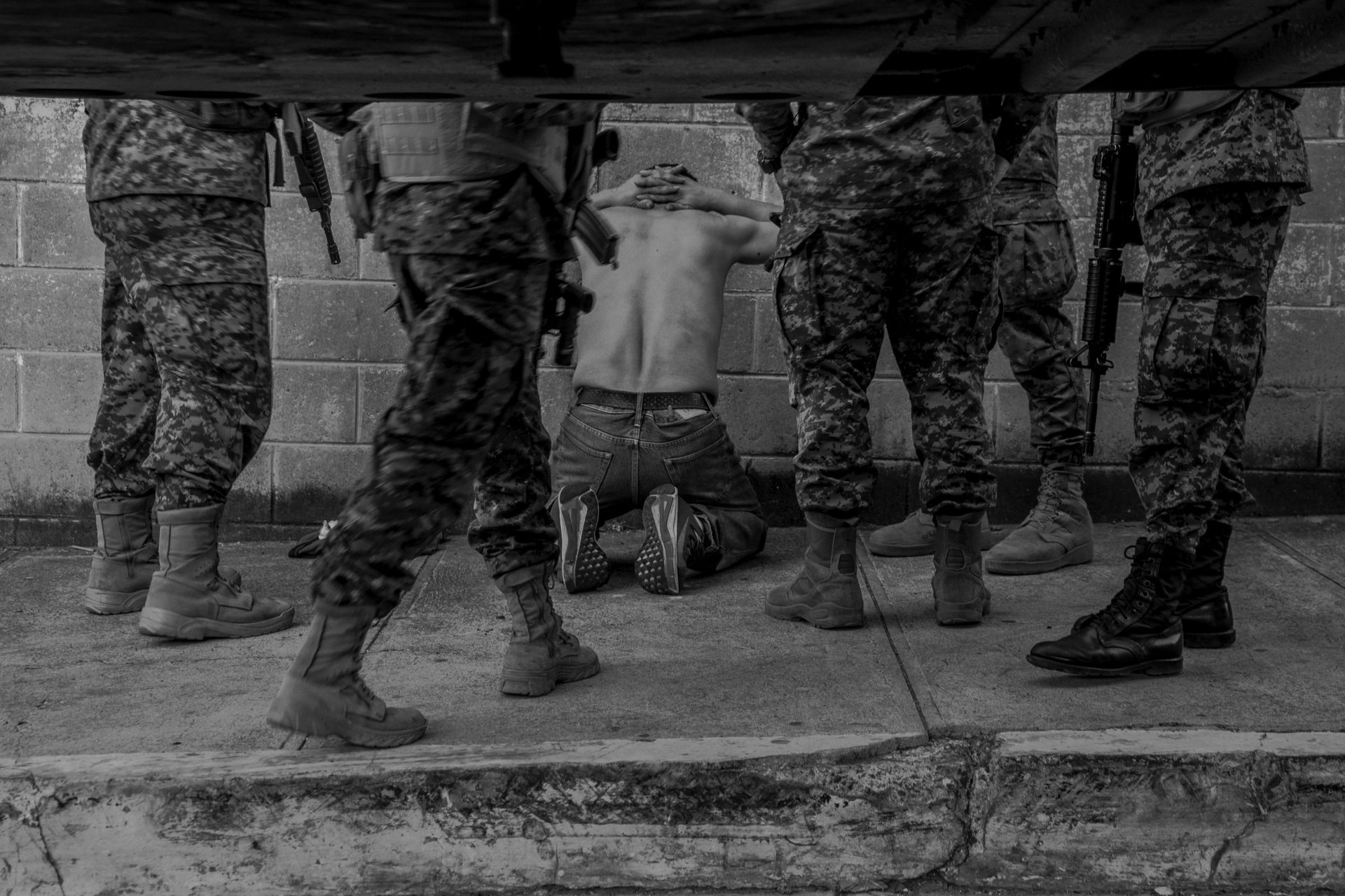 A man is taken into custody by police on the day the El Salvadoran Legislative Assembly approved the &ldquo;state of emergency.&rdquo; Since that day, more than 80,000 people have been arrested. Santa Telca, El Salvador.